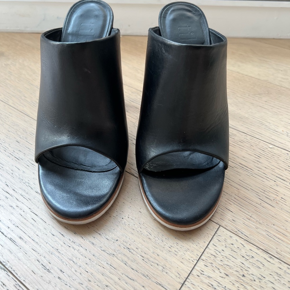 Tibi Bee mule in black leather.